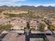 An aerial view of the apartment complex in a desert community, with mountain views in the distance at 20100 N 78Th Pl # 1062, Scottsdale, AZ 85255