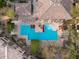 Birds eye view of a pristine community pool with a unique design, surrounded by lounge chairs and landscaping at 20100 N 78Th Pl # 1062, Scottsdale, AZ 85255