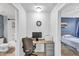 A practical home office space with a work desk is conveniently located between the bathroom and bedroom at 20100 N 78Th Pl # 1062, Scottsdale, AZ 85255