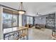 Open layout with a dining area, seamlessly integrated with a living room, and access to a balcony at 20100 N 78Th Pl # 1062, Scottsdale, AZ 85255
