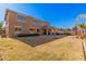 Large backyard with grassy area and home view at 20562 E Raven Dr, Queen Creek, AZ 85142