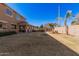 Expansive backyard with grassy area and view at 20562 E Raven Dr, Queen Creek, AZ 85142