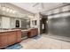 Large bathroom with dual vanities and a walk-in shower at 20562 E Raven Dr, Queen Creek, AZ 85142