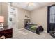 Cozy bedroom with a twin bed and access to a hallway at 20562 E Raven Dr, Queen Creek, AZ 85142