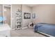 Bright bedroom with bookshelf and comfortable seating at 20562 E Raven Dr, Queen Creek, AZ 85142