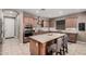 Island kitchen with stainless steel appliances and granite countertops at 20562 E Raven Dr, Queen Creek, AZ 85142