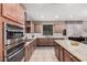 Modern kitchen with double ovens and granite countertops at 20562 E Raven Dr, Queen Creek, AZ 85142