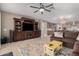 Open living space with a large sectional sofa, entertainment center and kitchen view at 20562 E Raven Dr, Queen Creek, AZ 85142