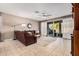Bright living room with sliding glass doors leading to backyard at 20562 E Raven Dr, Queen Creek, AZ 85142
