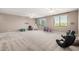 Bright and spacious playroom with toys and a ceiling fan at 20562 E Raven Dr, Queen Creek, AZ 85142