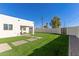 Artificial turf backyard with patio and block wall at 2129 S Los Feliz Dr, Tempe, AZ 85282