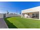Artificial turf backyard with patio and block wall at 2129 S Los Feliz Dr, Tempe, AZ 85282