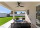 Covered patio with seating area and artificial turf at 2129 S Los Feliz Dr, Tempe, AZ 85282