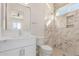 Modern bathroom with white vanity and marble shower at 2129 S Los Feliz Dr, Tempe, AZ 85282