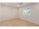 Bright bedroom featuring light wood floors and a ceiling fan at 2129 S Los Feliz Dr, Tempe, AZ 85282