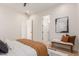 Bedroom with queen bed, neutral tones, and access to bath at 2129 S Los Feliz Dr, Tempe, AZ 85282