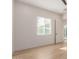 Simple bedroom with light wood floors and a window at 2129 S Los Feliz Dr, Tempe, AZ 85282
