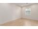 Bright bedroom with light wood floors and a window at 2129 S Los Feliz Dr, Tempe, AZ 85282