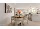 Kitchen features a round dining table with white chairs at 2129 S Los Feliz Dr, Tempe, AZ 85282