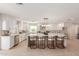 Modern kitchen with white cabinets, marble counters, and island at 2129 S Los Feliz Dr, Tempe, AZ 85282