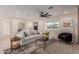Living room with comfy seating, coffee table, and large window at 2129 S Los Feliz Dr, Tempe, AZ 85282