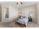 Well-lit bedroom featuring a comfortable bed and built-in shelving at 2166 W Peninsula Cir, Chandler, AZ 85248