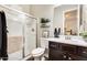 Clean bathroom with shower, toilet and dark wood vanity at 2238 E Saddlebrook Rd, Gilbert, AZ 85298