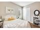 Well-lit bedroom with a comfortable bed and built-in shelving at 2238 E Saddlebrook Rd, Gilbert, AZ 85298