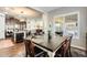 Bright dining area with a square table and six chairs near kitchen at 2238 E Saddlebrook Rd, Gilbert, AZ 85298
