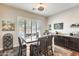 Charming dining room with a farmhouse table and six chairs at 2238 E Saddlebrook Rd, Gilbert, AZ 85298
