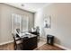 Spacious home office with a large desk and comfortable chair at 2238 E Saddlebrook Rd, Gilbert, AZ 85298