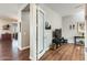 Living room features a sectional sofa, hardwood floors, and a flat-screen TV at 2238 E Saddlebrook Rd, Gilbert, AZ 85298