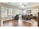 Spacious main bedroom with hardwood floors, large windows and a ceiling fan at 2238 E Saddlebrook Rd, Gilbert, AZ 85298