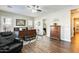 Main bedroom with hardwood floors, large windows and a ceiling fan at 2238 E Saddlebrook Rd, Gilbert, AZ 85298
