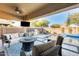 Relaxing backyard oasis with a sparkling pool, patio furniture, and built-in BBQ at 2238 E Saddlebrook Rd, Gilbert, AZ 85298