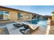 Relaxing poolside retreat with lounge chairs and umbrella at 2238 E Saddlebrook Rd, Gilbert, AZ 85298