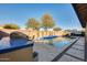 Inviting swimming pool with a spacious deck and surrounding landscaping at 2238 E Saddlebrook Rd, Gilbert, AZ 85298