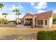 Relaxing backyard with patio, landscaping, and desert plants at 22713 N Dusty Trail Blvd, Sun City West, AZ 85375