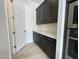 Walk-in pantry with dark cabinets and white quartz countertops at 2455 E Presidio St, Mesa, AZ 85213