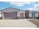 Modern house exterior with stone accents and a two-car garage at 2651 N Lema Dr, Mesa, AZ 85215