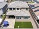 Two-story house with backyard patio and artificial turf at 27165 N 71St Ln, Peoria, AZ 85383