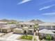 Two-story house with a landscaped yard and a two-car garage at 27165 N 71St Ln, Peoria, AZ 85383