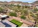 Aerial view of backyard, showing desert landscaping and a grassy area at 27165 N 71St Ln, Peoria, AZ 85383