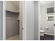 Simple bathroom with toilet and access to a closet at 27165 N 71St Ln, Peoria, AZ 85383