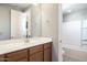 Clean bathroom with a single sink and bathtub at 27165 N 71St Ln, Peoria, AZ 85383