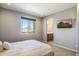 Main bedroom with a bed and ensuite bathroom at 27165 N 71St Ln, Peoria, AZ 85383