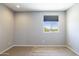 Bright bedroom with carpet flooring and a window offering a view at 27165 N 71St Ln, Peoria, AZ 85383