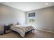 Guest bedroom with a comfortable bed and window view at 27165 N 71St Ln, Peoria, AZ 85383
