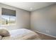 Simple bedroom with a bed, window and mountain view at 27165 N 71St Ln, Peoria, AZ 85383