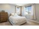 Well-lit bedroom with a queen bed and plenty of closet space at 27165 N 71St Ln, Peoria, AZ 85383